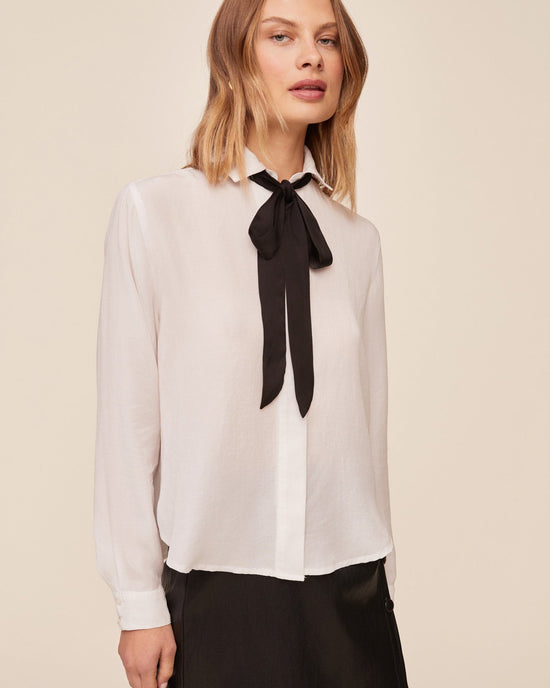 Opens /collections/tops